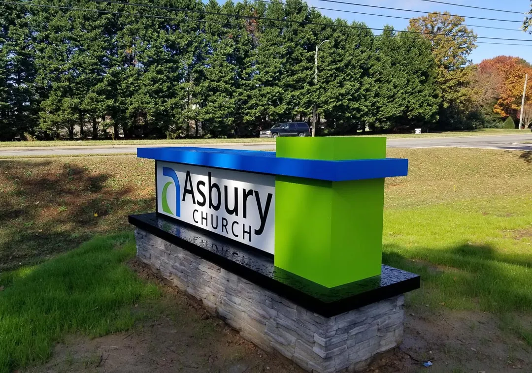 Monument on stone base for Asbury Church