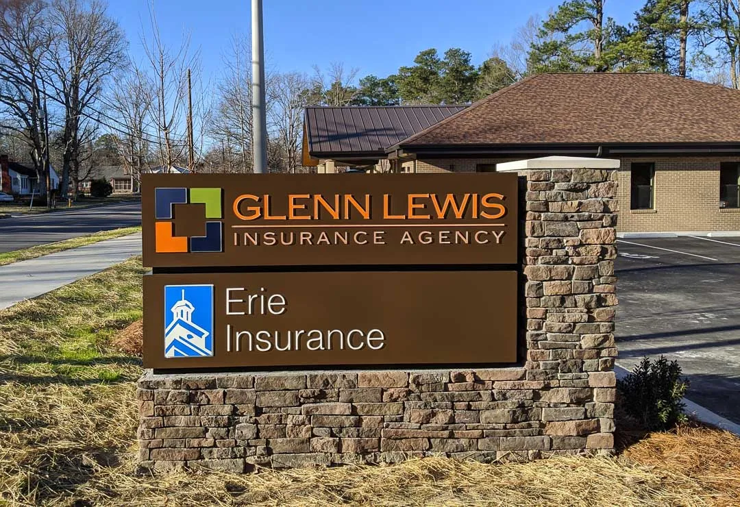 Stone column monument with two panels for Glenn Lewis / Erie Insurance