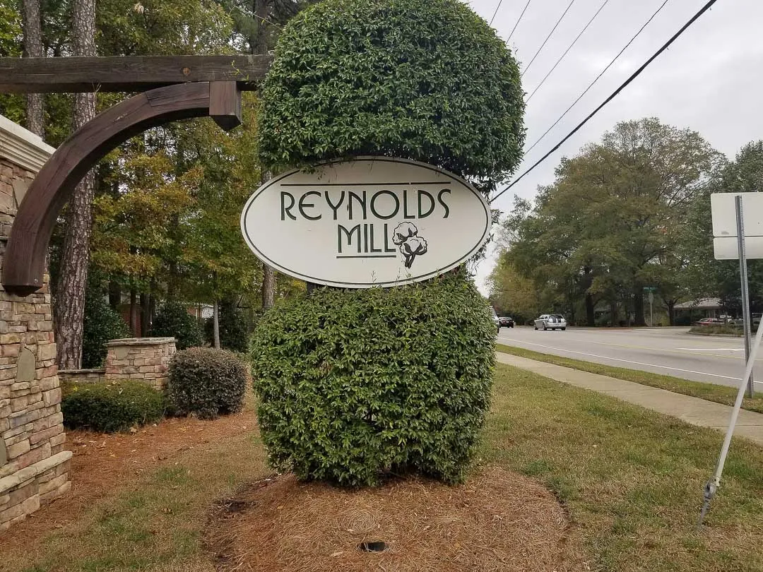 Oval sign on timber arm for Reynolds Mill