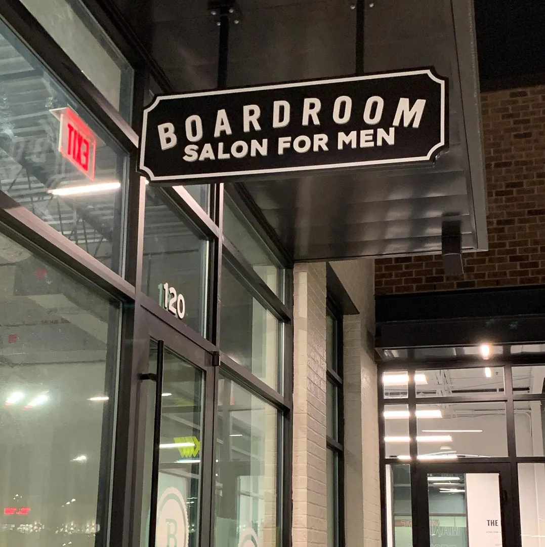 Hanging blade sign for Boardroom Salon