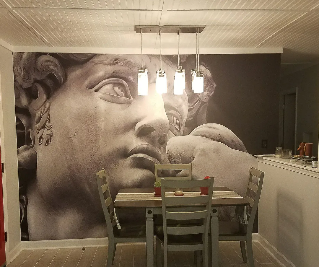 Wall mural, statue face