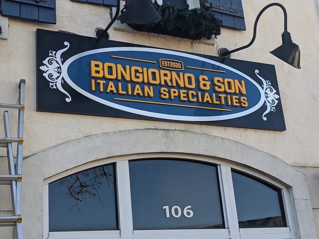 Carved wall sign with gooseneck lights for Bongiorno & Son