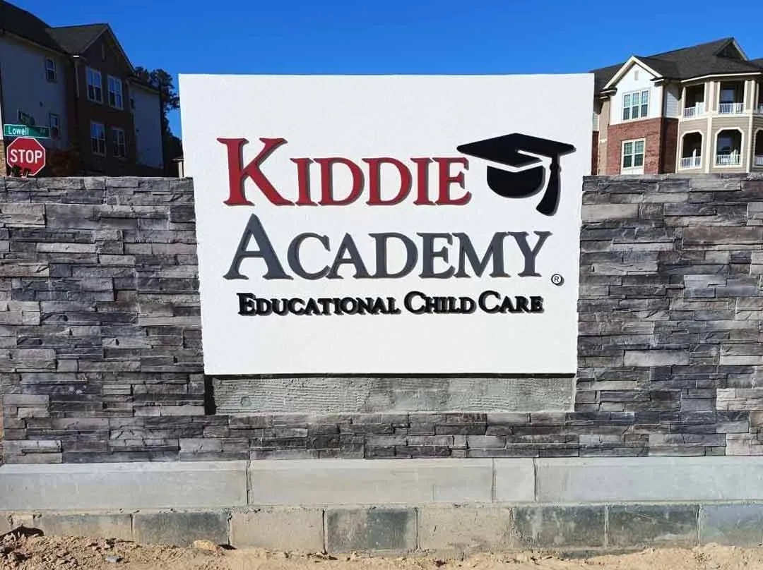 Panel on stone monument for Kiddie Academy