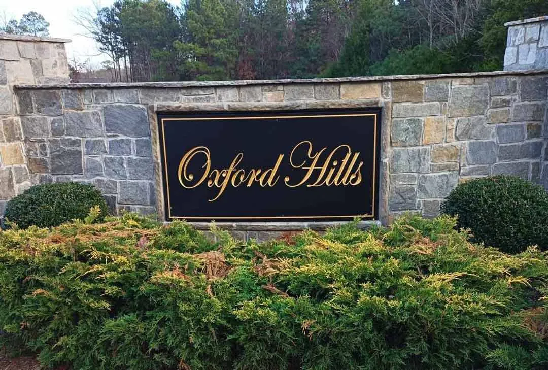 Plaque on stone wall for Oxford Hills