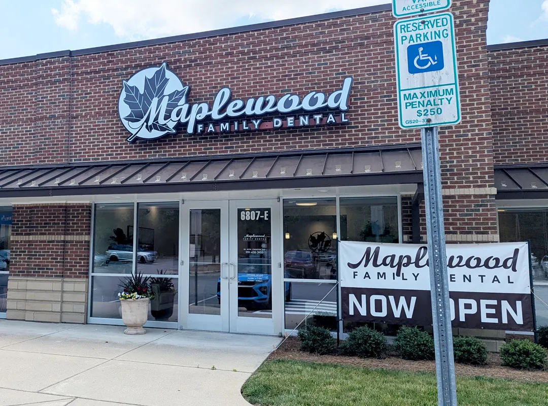 Lit dimensional logo on building for Maplewood Family Dental