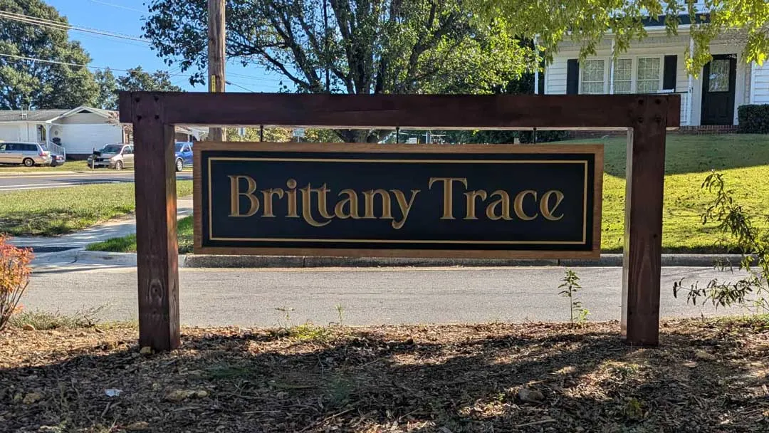 Hanging sign on timber frame for Brittany Trace