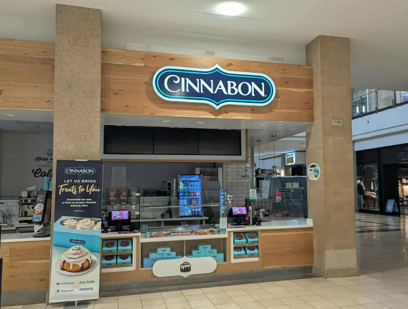 Mall kiosk lit sign for Cinnabon
