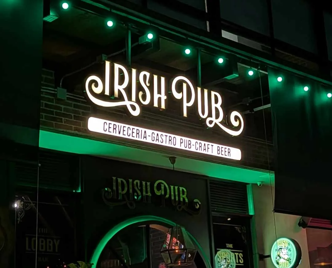 Lit sign at night for Irish Pub