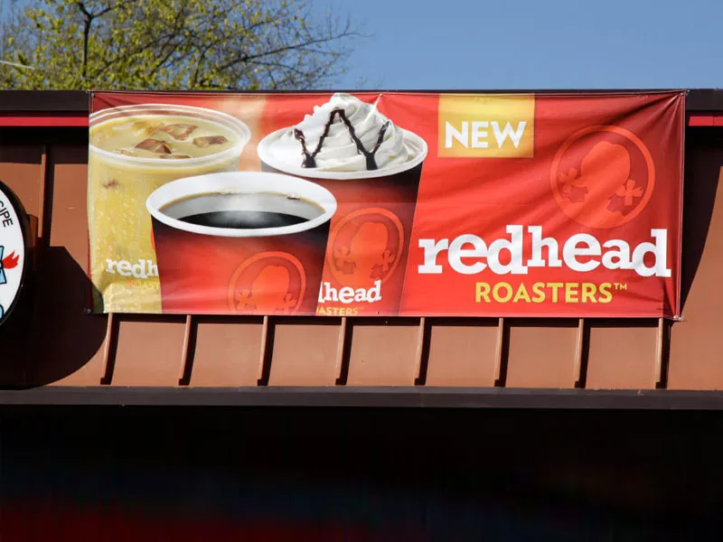 Vinyl banner on building for Redhead Roasters (McDonald's)