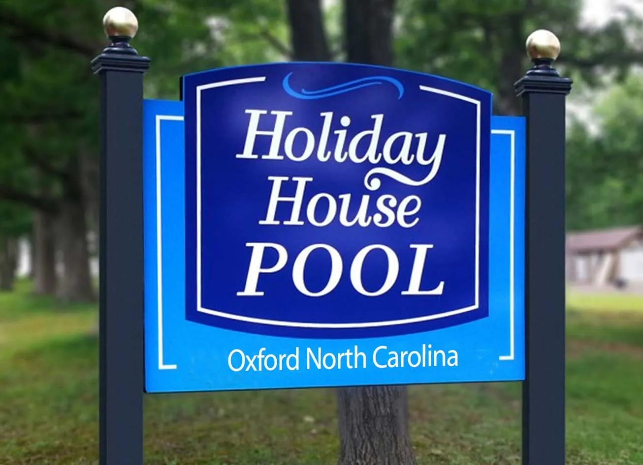 Post and panel sign for Holiday House Pool